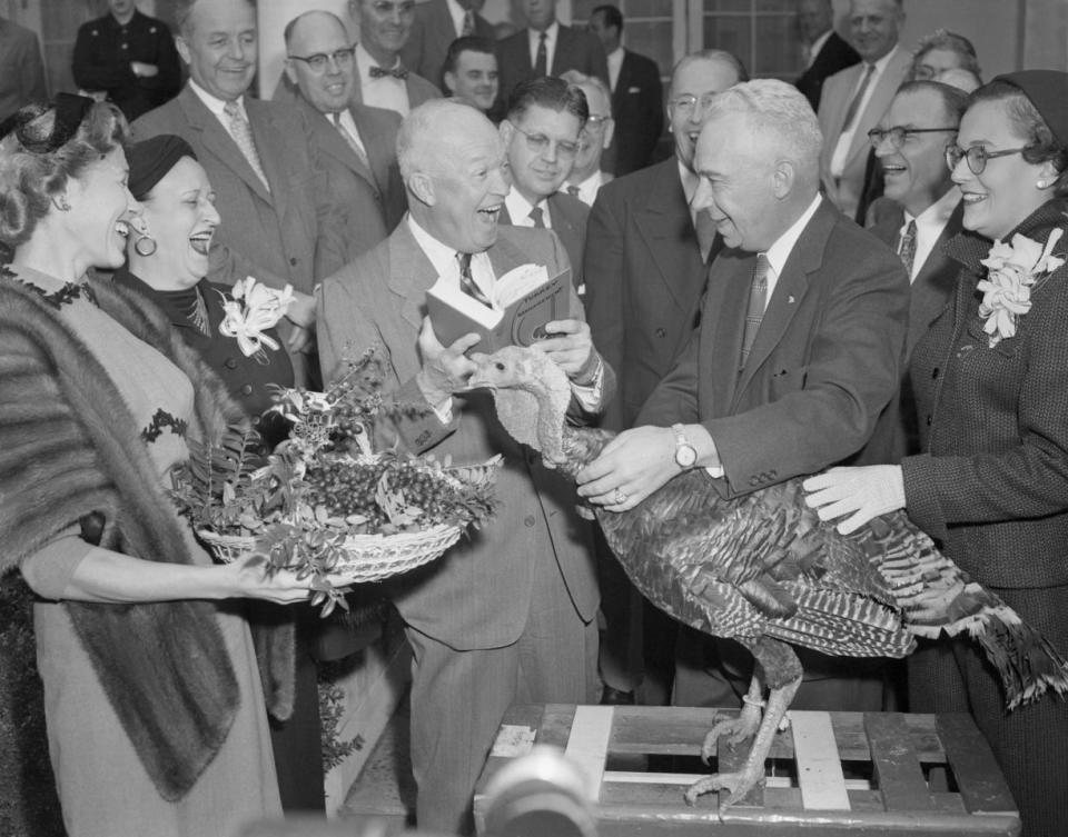 <p>President Eisenhower (left) seems highly pleased with the 43-pound Kentucky colonel turkey from the blue-grass state, presented to him at the White House by Peary Browning (right) of Winchester, Kentucky, president of the National Turkey Federation on Nov. 17, 1954. The Thanksgiving bird was selected from a flock of 100,000 at Browning’s farm. (Photo: Bettmann/Corbis/Getty Images) </p>