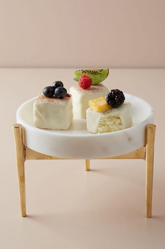 If they put their desserts on a pedestal, they'll thank you for this cake stand. It's much more modern than the traditional ones you might be used to seeing. This stand is made from marble and brass. <a href="https://fave.co/2GwhUK0" target="_blank" rel="noopener noreferrer">Find it for $58 at Anthropologie</a>. 