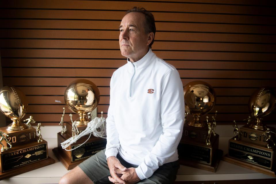 Ricky Bowers, Ensworth AD, the recipient of the Fred Russell Lifetime Achievement Award as given by The Tennessean, sits among his 9 different trophies at Ensworth High School in Nashville , Tenn., Thursday, June 1, 2023.