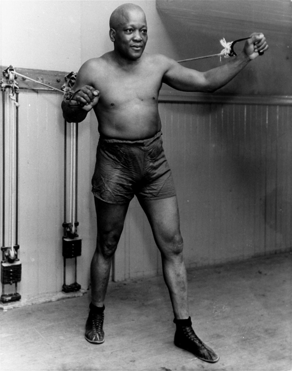 FILE – In this 1932 photo, boxer Jack Johnson poses for a photo in New York City at the age of 54. (AP Photo/File)