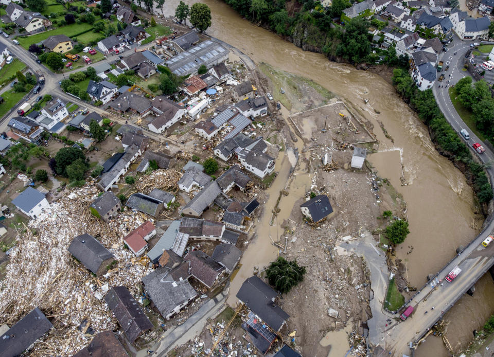 In this July 15, 2021 file photo estroyed houses are seen close to the Ahr river in Schuld, Germany. Due to heavy rain falls the Ahr river dramatically went over the banks the evening before. (AP Photo/Michael Probst, file)