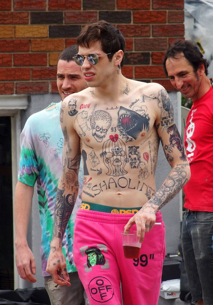 Pete Davidson shirtless and with many, many chest and arm tattoos