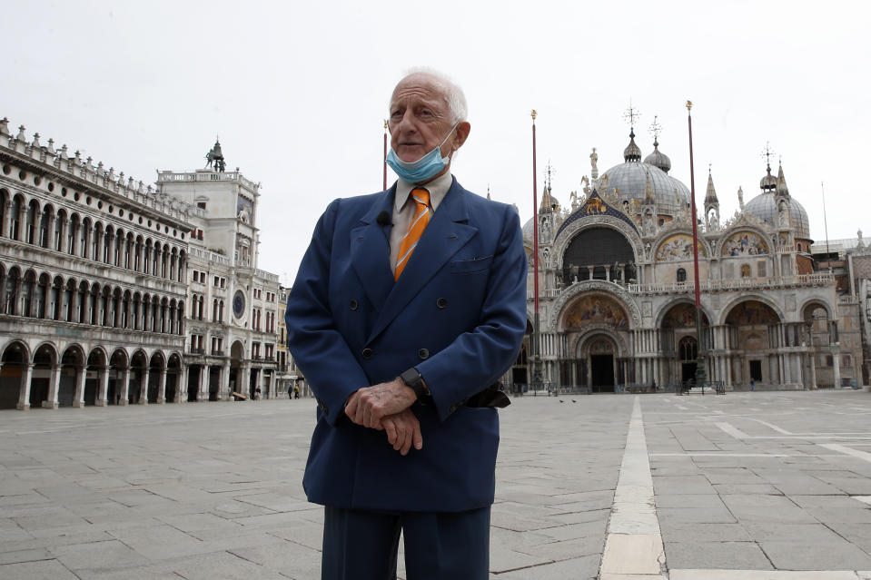 In this picture taken on Wednesday, May 13, 2020, Arrigo Cipriani, owner of Harry's Bar, talks with The Associated Press in St. Mark's Square in Venice, Italy. Venetians are rethinking their city in the quiet brought by the coronavirus pandemic. For years, the unbridled success of Venice's tourism industry threatened to ruin the things that made it an attractive destination to begin with. Now the pandemic has ground to a halt Italy’s most-visited city, stopped the flow of 3 billion euros in annual tourism-related revenue and devastated the city's economy. (AP Photo/Antonio Calanni)