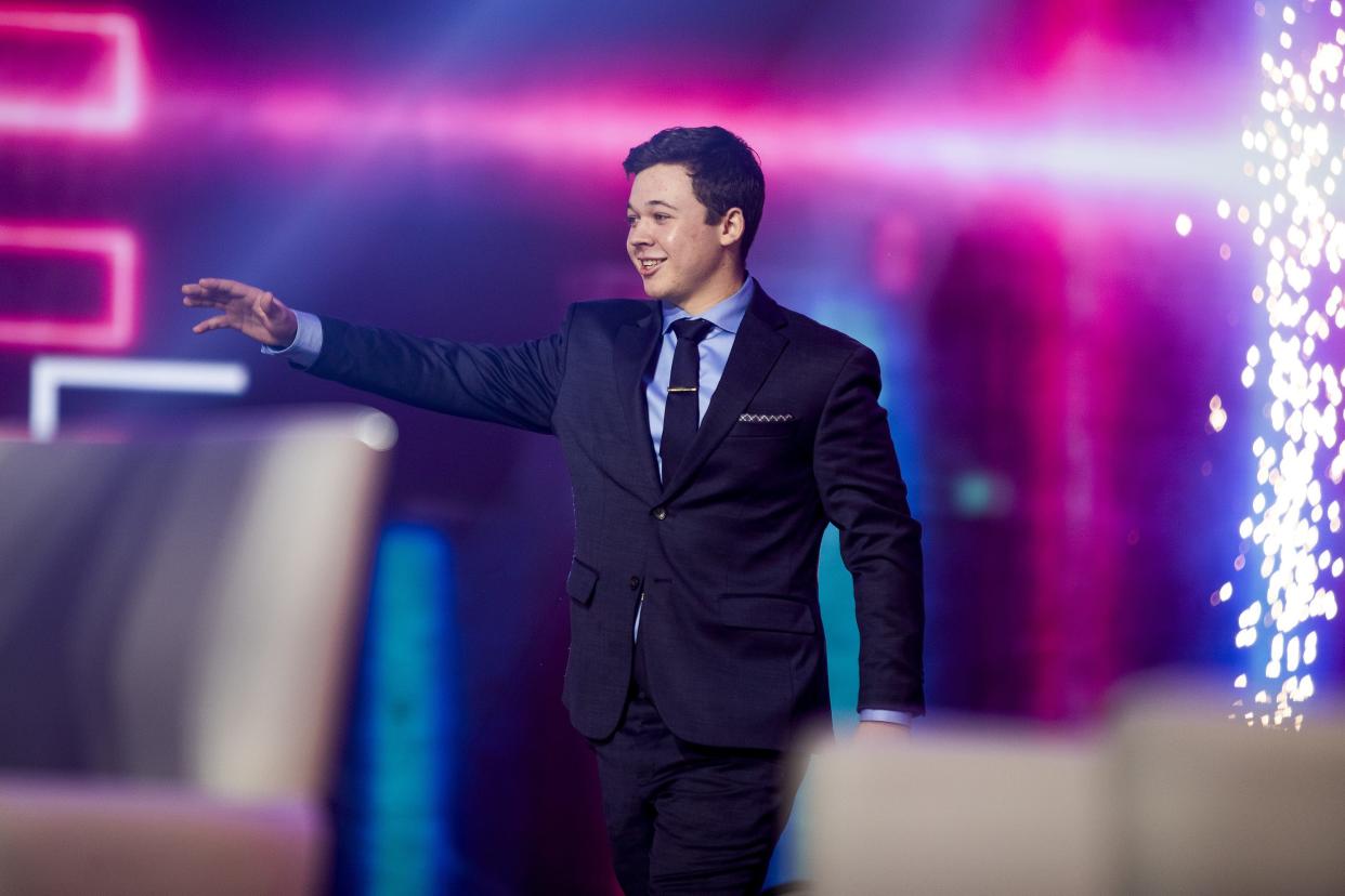 Kyle Rittenhouse greets the crowd before a panel discussion during the third day of AmericaFest 2021 hosted by Turning Point USA on Sunday, Dec. 19, 2021, in Phoenix.