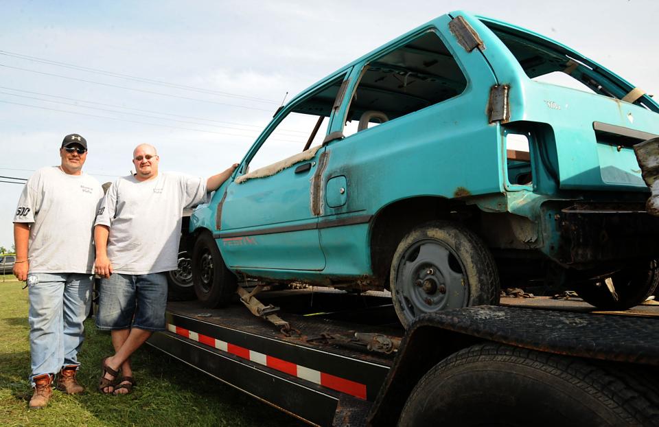 Jason Goff (right) and his brother, Rick, entered the 2013 Monroe County Fair Demolition Derby with a Ford Festiva. Jason raced in memory of his late father, Merlin, who won the first ever derby in 1973. Between Merlin, Jason, and Rick, the family has 14 all-time feature wins.
