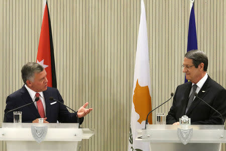 Jordan's King Abdullah speaks next to Cypriot President Nicos Anastasiades during a news conference at the Presidential Palace in Nicosia, Cyprus January 16, 2018. REUTERS/Yiannis Kourtoglou