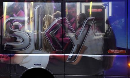 FILE PHOTO: Workers ride on a Sky employee shuttle bus near their headquarters in west London, January 25, 2017. REUTERS/Toby Melville/File Photo