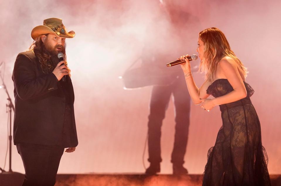 Chris Stapleton, left, and Carly Pearce perform "We Don't Fight Anymore at the 57th Annual CMA Awards on Wednesday, Nov. 8, 2023, at the Bridgestone Arena in Nashville, Tenn.