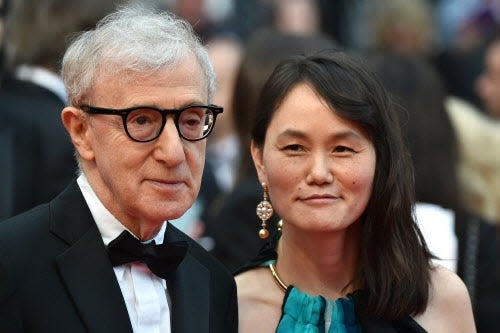 US director Woody Allen and his wife Soon-Yi Previn pose as they arrive on May 11, 2016 for the screening of the film "Cafe Society" during the opening ceremony of the 69th Cannes Film Festival in Cannes, southern France.  / AFP PHOTO / ALBERTO PIZZOLIALBERTO PIZZOLI/AFP/Getty Images ORIG FILE ID: 551769689