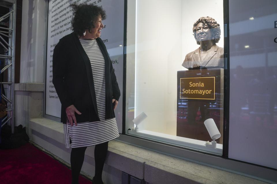 Supreme Court Justice Sonia Sotomayor reviews a statue of herself after its unveiling at Bronx Terminal Market, Thursday, Sept. 8, 2022, in New York. (AP Photo/Bebeto Matthews, Pool)