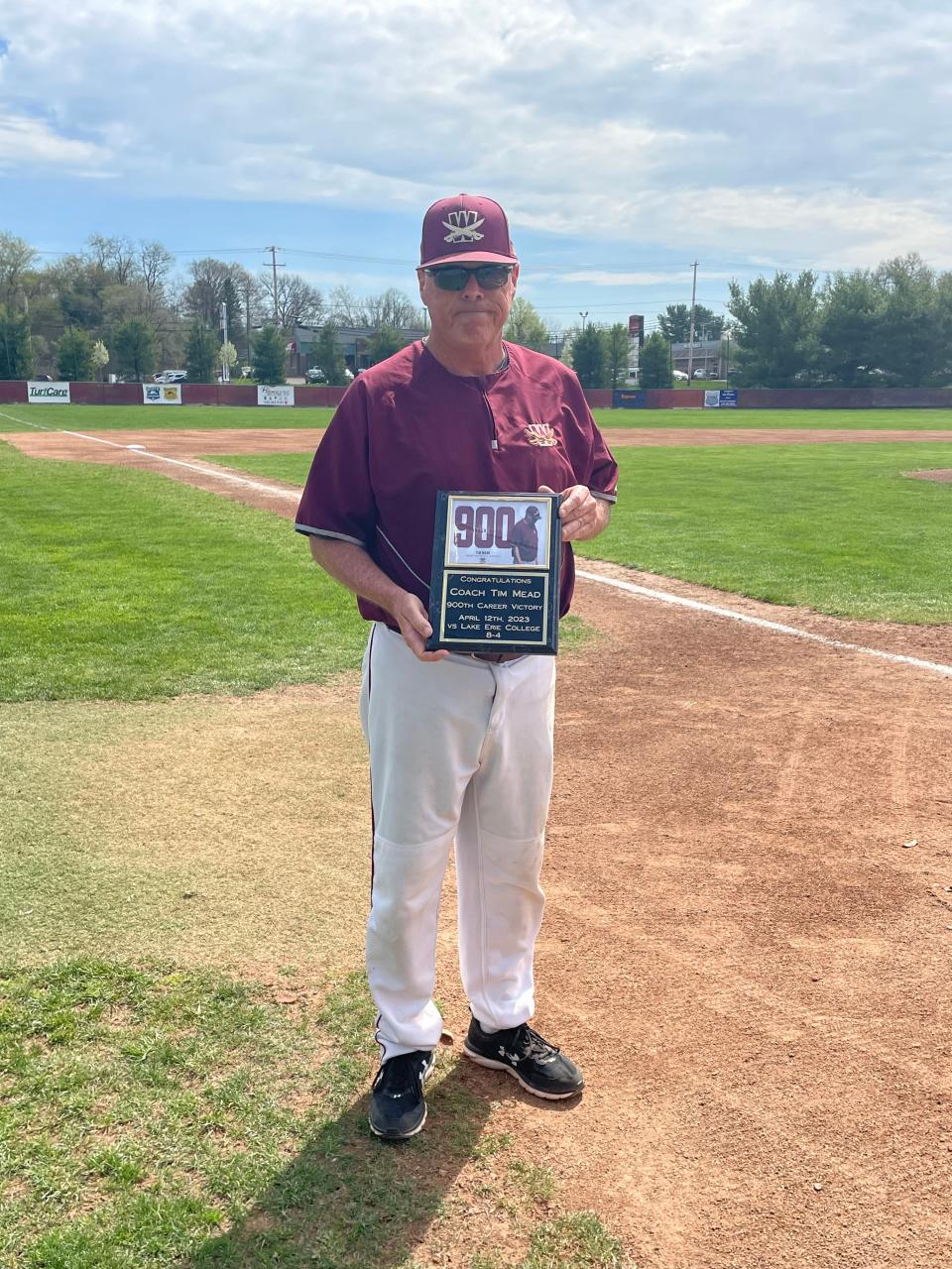 Walsh University baseball coach Tim Mead is honored for winning his 900th career game during last weekend's home series against Ashland.