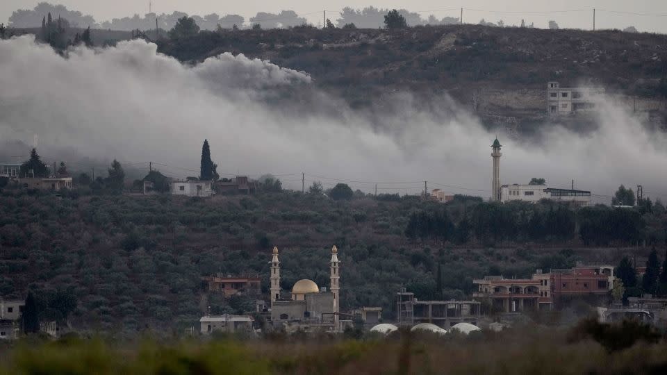 Smoke rises from Israeli artillery shelling in Dahaira, in southern Lebanon, at the border with Israel on October 16. - Hussein Malla/AP