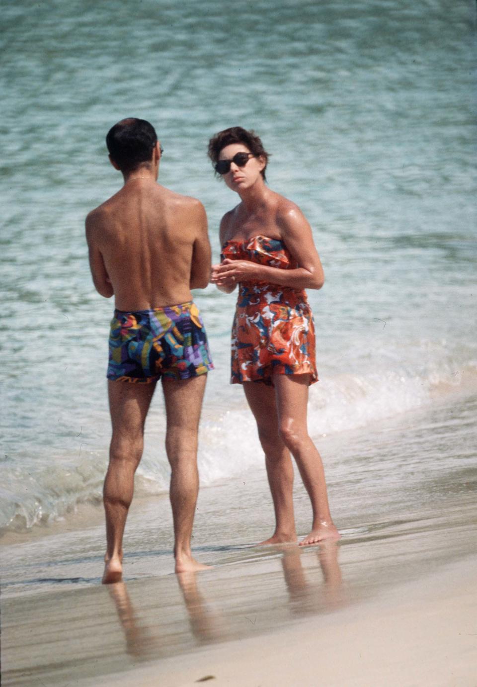 Princess Margaret in swimming costume chats to a friend on the beach whilst on holiday in Mustique in 1976.  Photo: Anwar Hussein