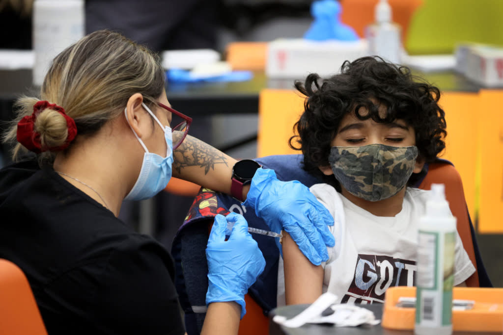 a child receive vaccine injection