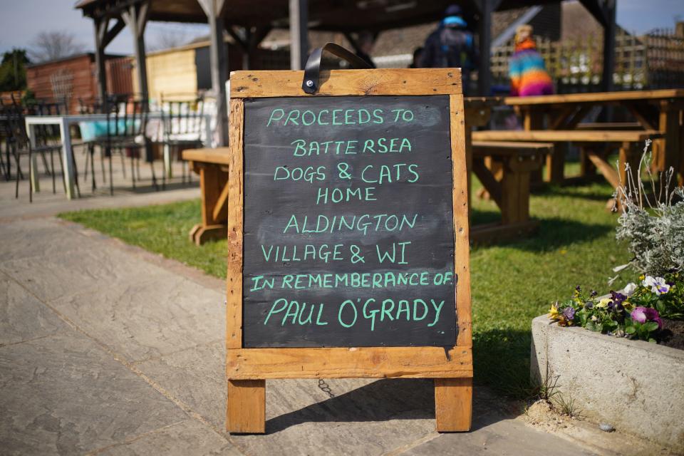 A sign outside the Walnut Tree Pub in Aldington, Kent, ahead of the cortege for Paul O'Grady travelling past on the way to his funeral at St Rumwold's Church. Picture date: Thursday April 20, 2023.