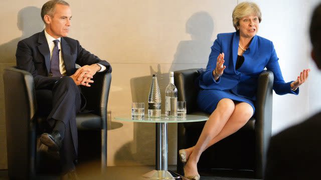 Mark Carney with the the Prime Minister Theresa May as she answers an audience question, at the Bank of England 'Independence 20 years on' conference