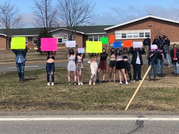 During the walkout on Thursday, Thornhill cheered her classmates from across the street because she wasn't allowed on school grounds.