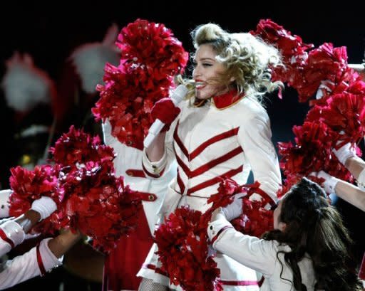 US pop diva Madonna (C) performs during her "MDNA" world tour at the Olympic Stadium in Kiev on August 4. Madonna said Tuesday at her Moscow concert that she prayed for the freedom of the three members of the Pussy Riot protest band who face three years in jail for insulting Vladimir Putin in a church