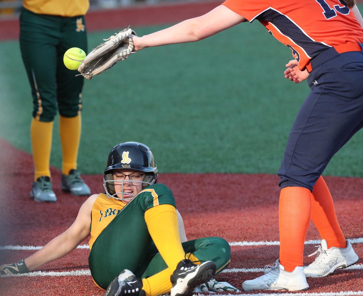 Firestone Breonna Potter steals home on a passed ball as Ellet pitcher Rylie Sprouse covers the plate during their game at Firestone Stadium on Monday, April 29, 2024 in Akron.
