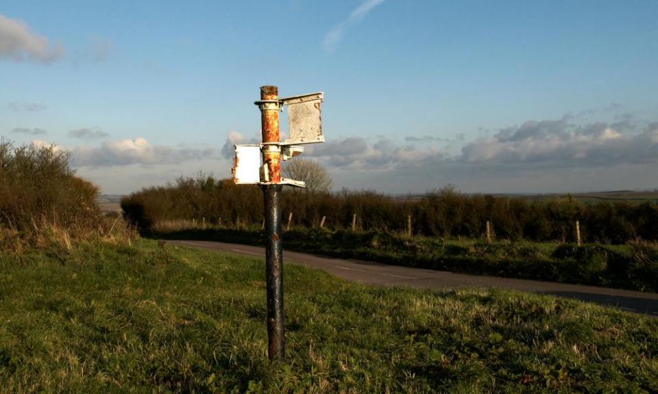 remains of signpost on Eggardon hill in Dorset devoid of any places names.