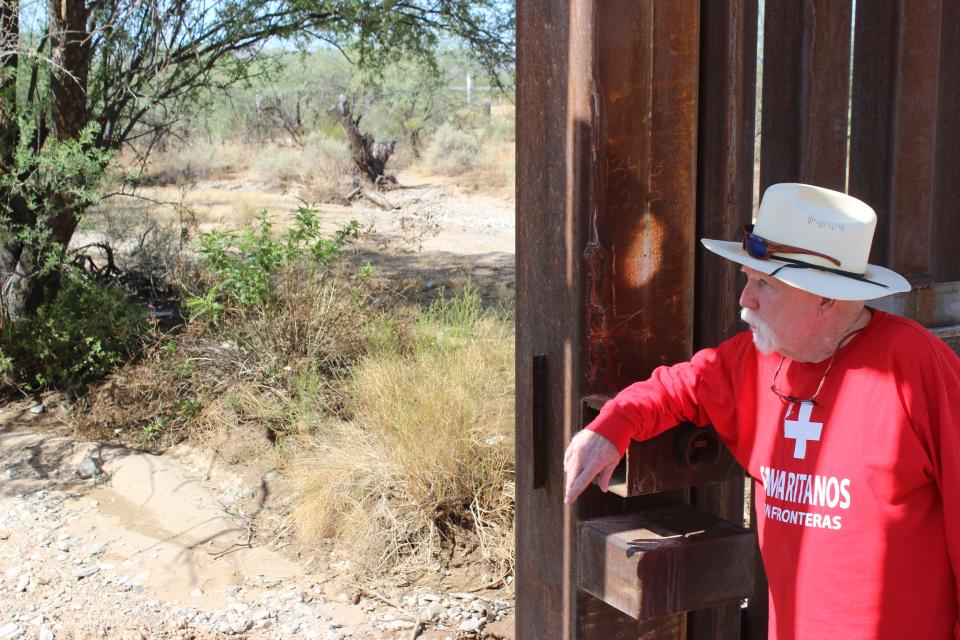 Tom Wingo, 76, refills water drums and gives water to migrants on the Organ Pipe Cactus National Monument west of Lukeville on Aug. 22, 2023.