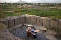 <p>Canadian Forces soldier, Cpl. Ben Vandandaigue, plays on a drum kit, June 24, 2011, on Forward Operating Base Sperwan Ghar overlooking the Panjwaii district of Kandahar province, Afghanistan. (AP Photo/David Goldman) </p>