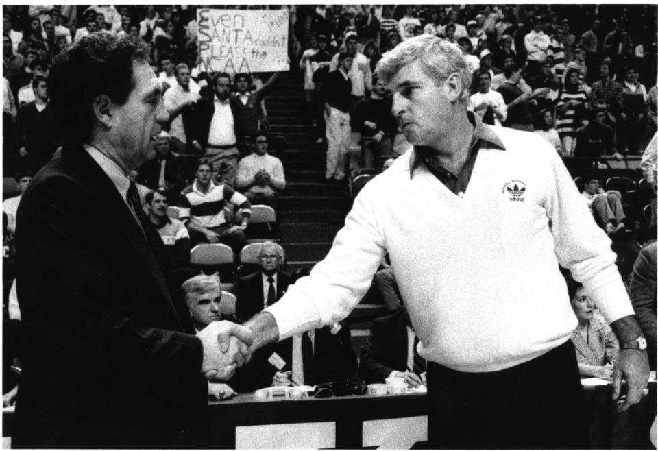 Then-Kentucky coach Eddie Sutton met with then-Indiana head man Bobby Knight before the Hoosiers beat the Wildcats 75-52 at Rupp Arena in 1988.