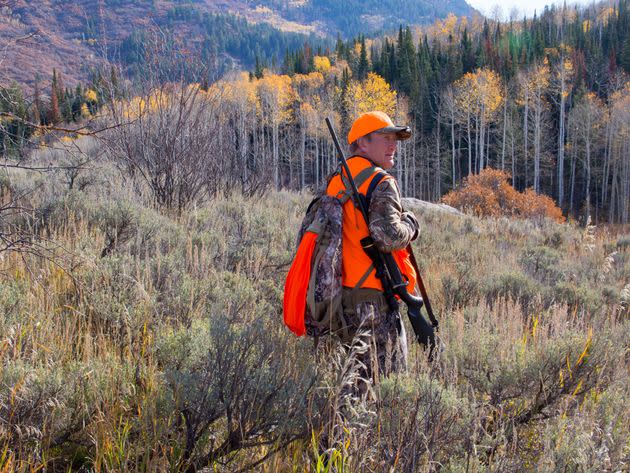 An elk hunter walks through a meadow in northwest Colorado. (Photo: Karen Desjardin via Getty Images)