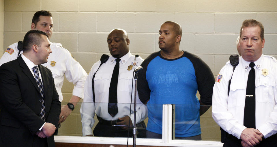 Gai Scott, second from right, of Randolph. Mass., stands during an arraignment, Monday, March 31, 2014, in Plymouth, Mass. Scott was arraigned on charges in the shooting of his uncle and reality TV star Benzino, who was shot Saturday during a funeral procession. (AP Photo/The Patriot Ledger, Greg Derr, Pool)