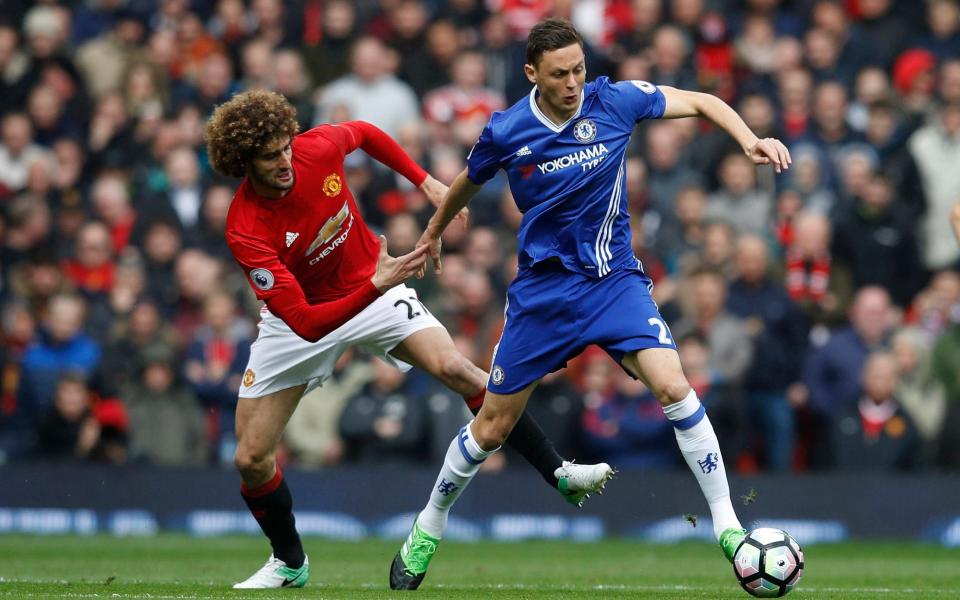 Manchester United's Marouane Fellaini in action with Chelsea's Nemanja Matic - Credit: REUTERS