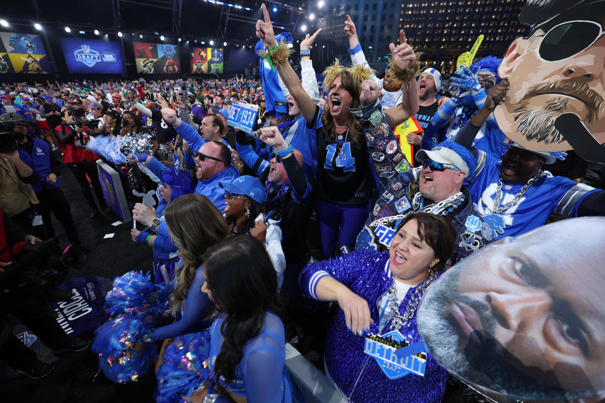 DETROIT, MICHIGAN - APRIL 26: Detroit Lions fans react to their third round draft pick during the 2024 NFL draft at Campus Martius Park on April 26, 2024 in Detroit, Michigan. (Photo by Gregory Shamus/Getty Images)