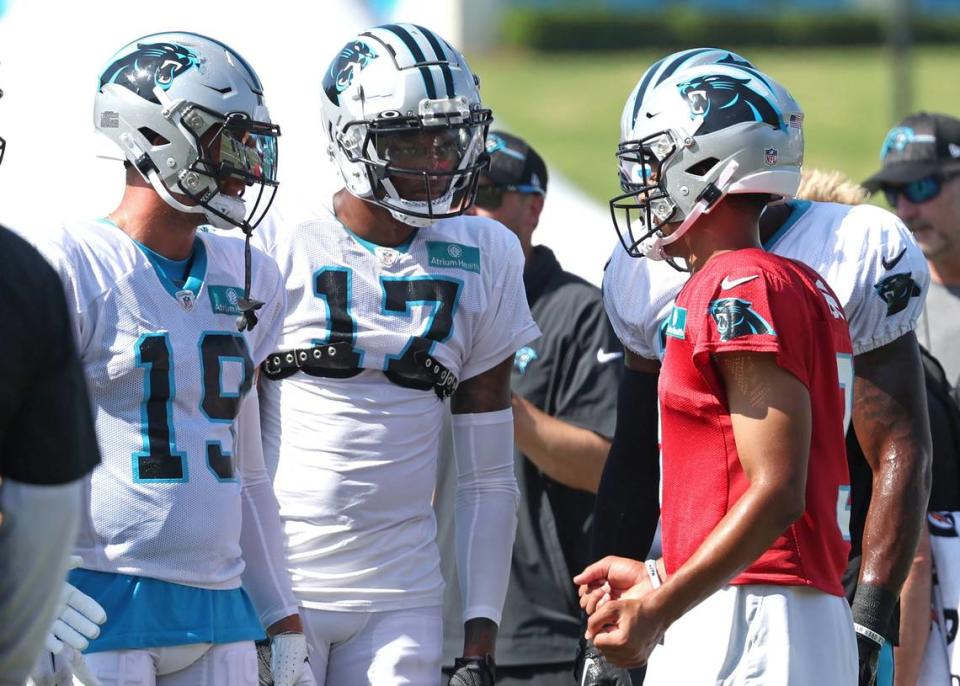 Carolina Panthers quarterback Bryce Young, right, talks to wide receivers Adam Thielen (19) and DJ Chark (17) prior to a drill during the team’s joint practice with the New York Jets on Wednesday, August 9, 2023 at Wofford College in Spartanburg, S.C.