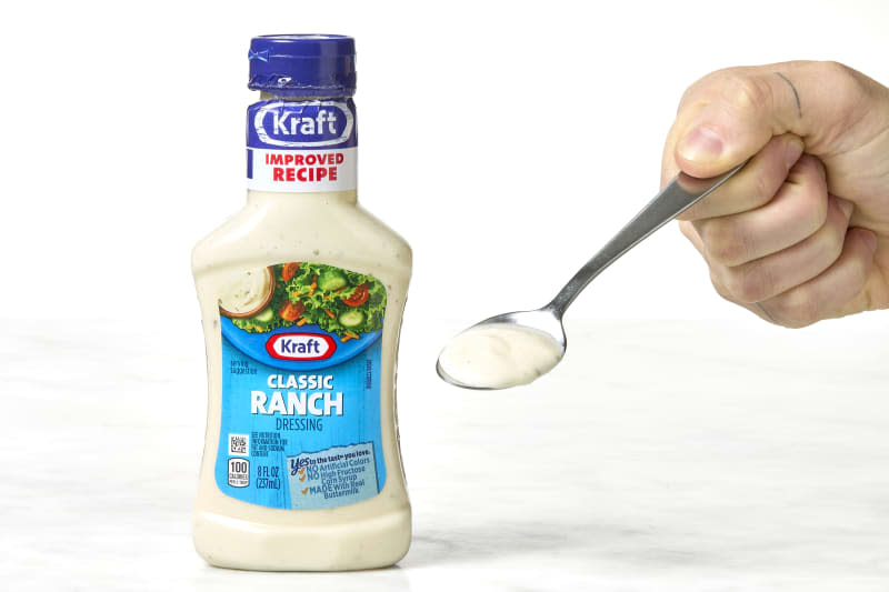 shot of a bottle of kraft classic ranch and some on a spoon.
