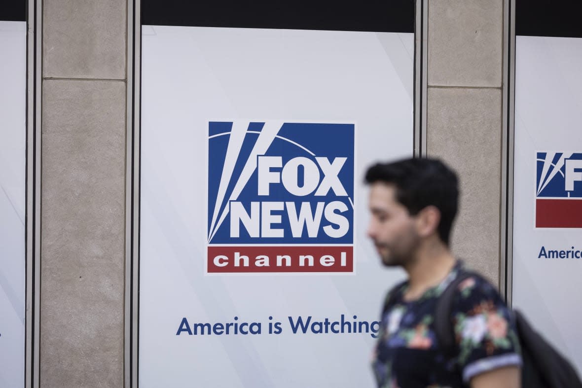 A person walks past the Fox News Headquarters in New York, April 12, 2023. (AP Photo/Yuki Iwamura, File)