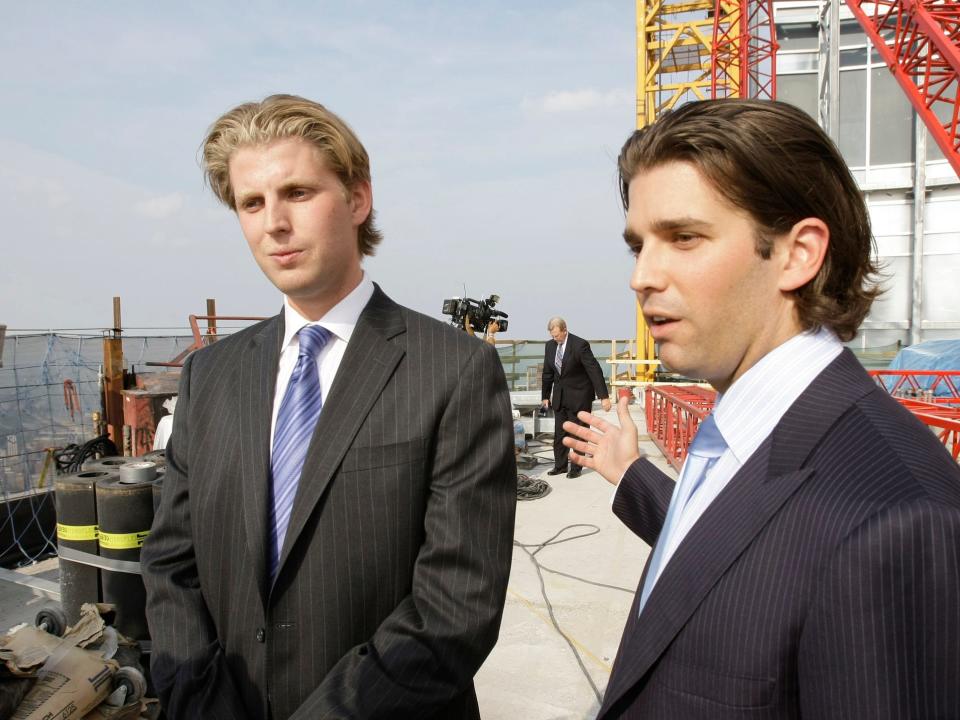 Eric and Donald Jr give a roof top interview during a topping off festivities for the 92-story Trump International Hotel and Tower in Chicago, Wednesday, Sept. 24, 2008.