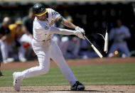 Oakland Athletics' Kevin Smith (1) breaks his bat for a single in the seventh inning of a baseball game against the Minnesota Twins in Oakland, Calif., on Wednesday, May 18, 2022. (AP Photo/Scot Tucker)