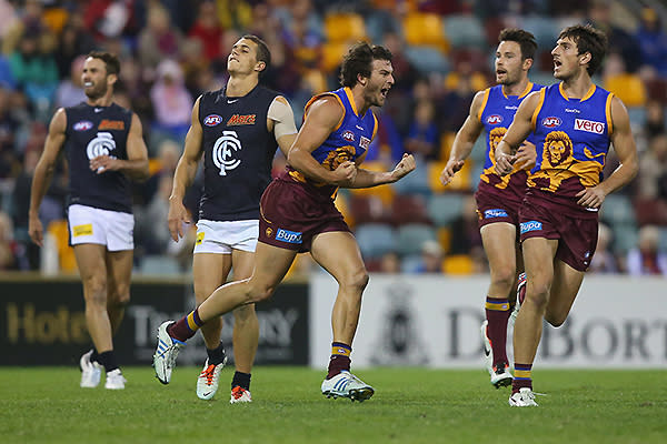 Rohan Bewick of the Lions celebrates a goal during the round nine AFL match between the Brisbane Lions and the Carlton Blues at The Gabba.