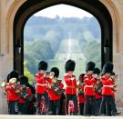 <p>The band marches through the George IV Gateway at Windsor Castle.</p>