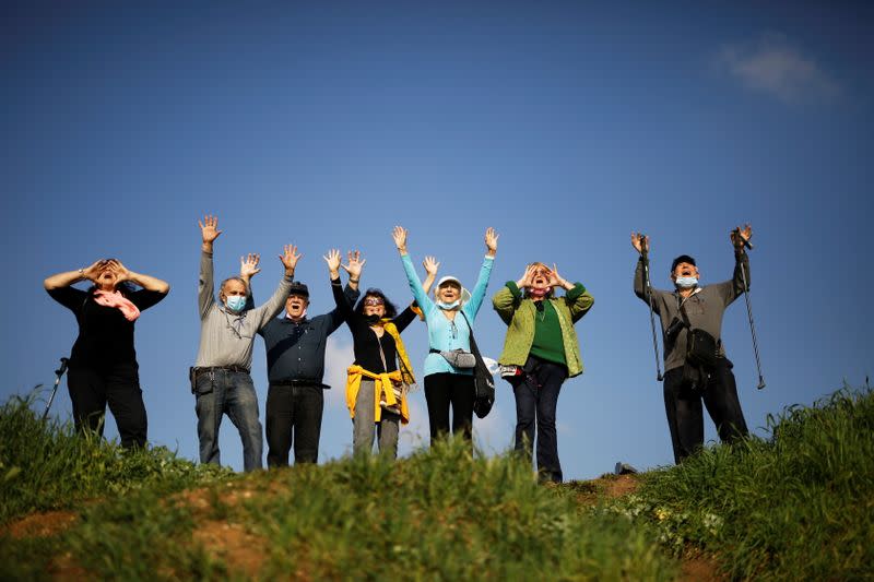 To lift lockdown gloom, Israelis keep calm and carry on screaming