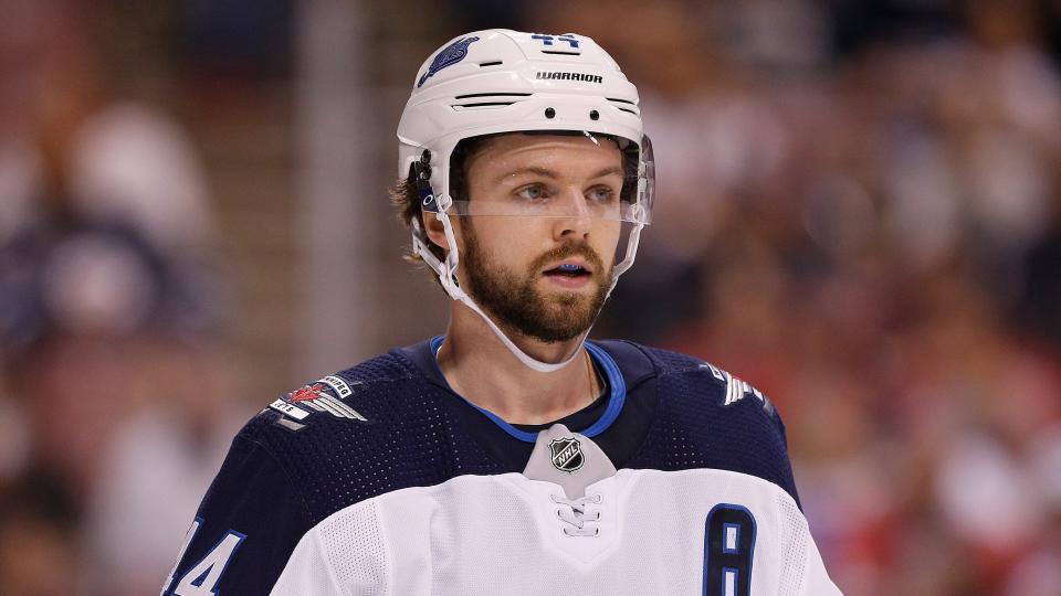 After an awkward puck deflection, defenceman Josh Morrissey left Saturday night's game injured. (Photo by Michael Reaves/Getty Images)