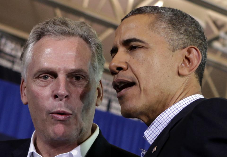 U.S. President Obama talks to McAuliffe at his campaign event for Governor in Arlington