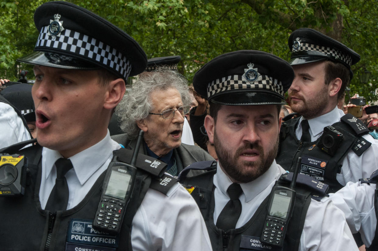 LONDON, ENGLAND - MAY 16: Piers Corbyn (brother of former Labour leader Jeremy Corbyn) is arrested as conspiracy theorists gather at Hyde Park Corner to defy the emergency legislation and protest their claim that the Coronavirus pandemic is part of a secret conspiracy on May 16, 2020 in London, United Kingdom. The prime minister has announced the general contours of a phased exit from the current lockdown, adopted nearly two months ago in an effort curb the spread of Covid-19. (Photo by Guy Smallman/Getty images)