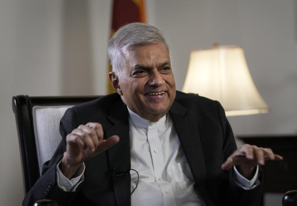 Sri Lanka's new prime minister Ranil Wickremesinghe gestures during an interview with The Associated Press in Colombo, Sri Lanka, Saturday, June 11, 2022. Sri Lanka may be compelled to buy more oil from Russia amid the island nation's unprecedented economic crisis, even as Western nations have largely boycotted Moscow as punishment for its invasion of Ukraine, the newly appointed prime minister said. (AP Photo/Eranga Jayawardena)