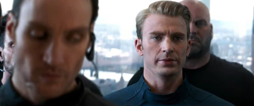 Steve Rogers standing in an elevator with secret HYDRA agents in "Avengers: Endgame"