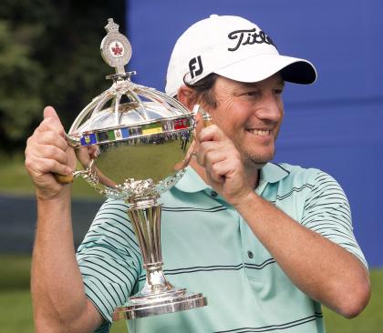 Tim Clark fired a final-round 65 to win the Canadian Open in Quebec. (AP) 