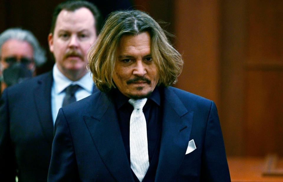 Actor Johnny Depp walks into the courtroom at the Fairfax County Circuit Court in Fairfax, Virginia (Brendan Smialowski, Pool via AP) (AP)