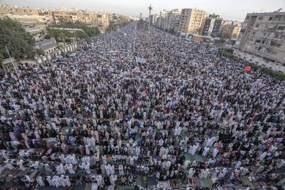 Egyptian Muslims perform Eid al-Fitr prayers outside al-Seddik mosque in Cairo, Egypt, Friday, April 21, 2023. Large parts of the Muslim world marked the end of the fasting month of Ramadan at sundown Thursday and started Friday the holiday of Eid al-Fitr, but the festivities were overshadowed by raging battles in Sudan and a deadly stampede in Yemen. (AP Photo/Amr Nabil)