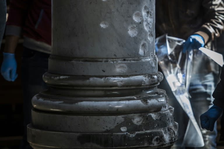 Egyptian security forces inspect the scene of a bomb explosion at the Saint Peter and Saint Paul Coptic Orthodox Church in Cairo on December 11, 2016