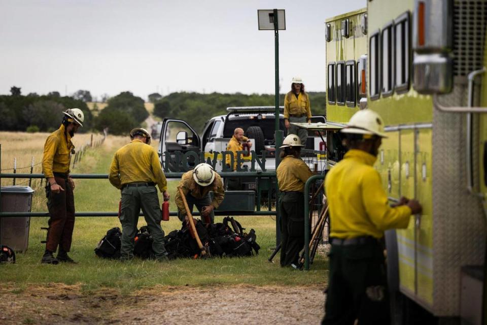 The interagency hot spot crew loads up their gear before going in to inspect the Dempsey Fire, which burned almost 12,000 acres Monday, June 27, 2022 near Palo Pinto.