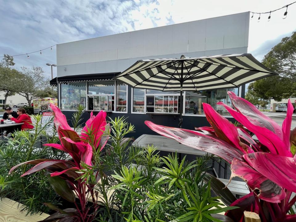 Everything from the planter boxes to the paint is new at Bimini Bites Home of The Flying Dog in Cape Coral.